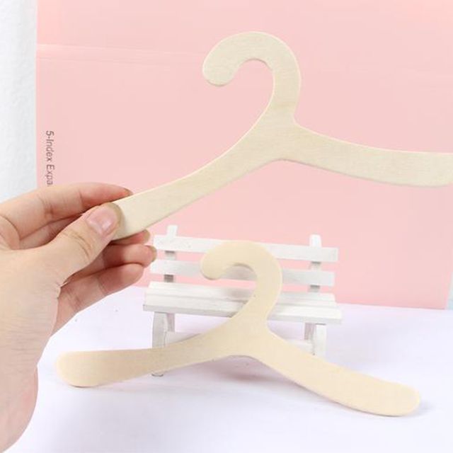 White plastic hanger for pet clothing display