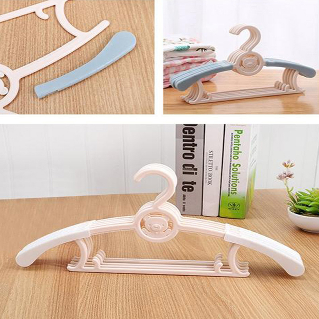 Foldable plastic hangers for pet clothing packaging