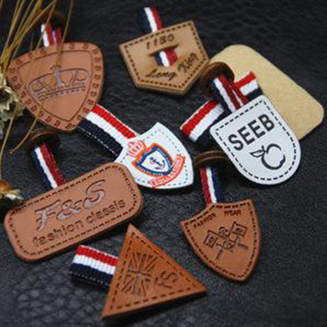 Assorted embossed leather labels for custom pet clothing